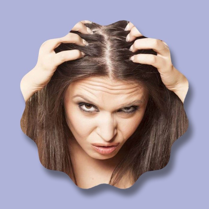 woman pulling hair out purple background