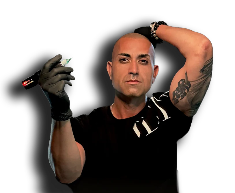 Alex Asher, SCALPS founder and SMP artist, holding his tattoo machine