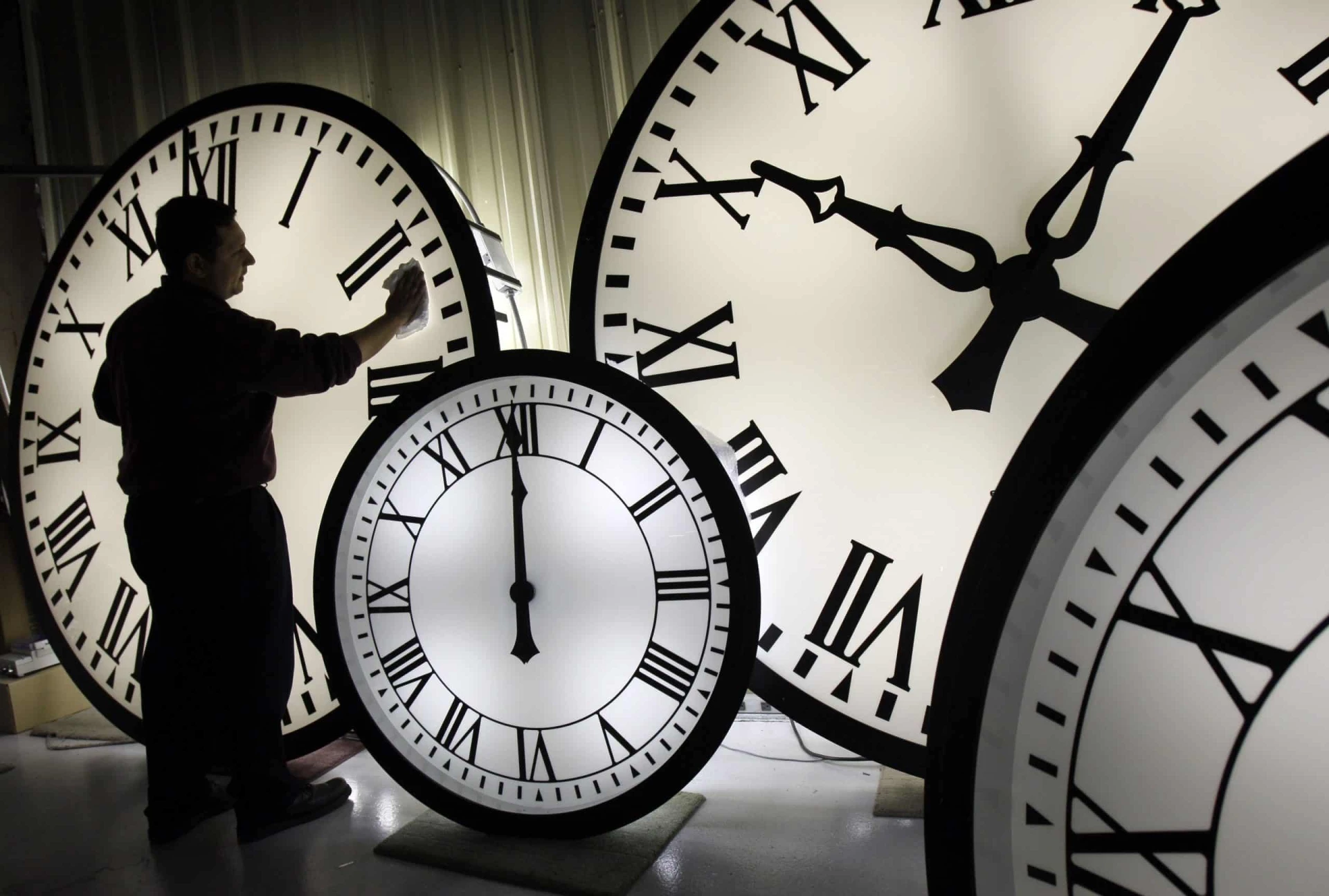 BLOG | Scalp Micropigmentation Centers 24 picture of man next to clocks